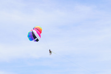 The sky parachute has a blue backdrop background.