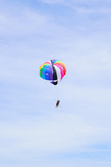 The sky parachute has a blue backdrop background.