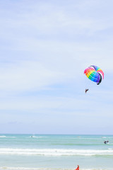 The sky parachute has a blue backdrop background.