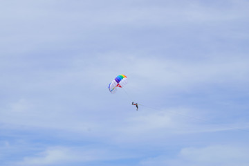 Naklejka na ściany i meble The sky parachute has a blue backdrop background.