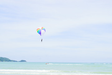 The sky parachute has a blue backdrop background.