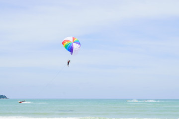 The sky parachute has a blue backdrop background.