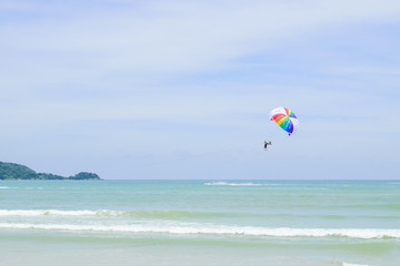 The sky parachute has a blue backdrop background.