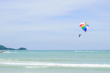 Parachutes in the sky float over the Andaman Sea.