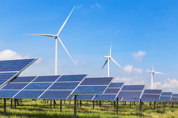 solar panels and wind turbines generating electricity in power station green energy renewable with blue sky background  - 174528746