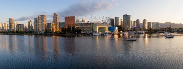 Obraz na płótnie Canvas Panoramic view of Vancouver Downtown City Skyline in False Creek, British Columbia, Canada. Taken during a bright summer sunrise.