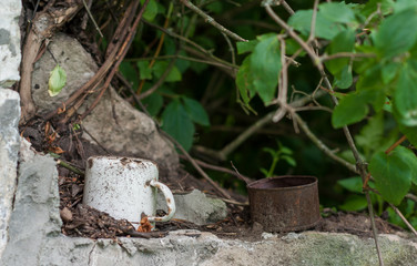 old enameled cup in a forgotten place