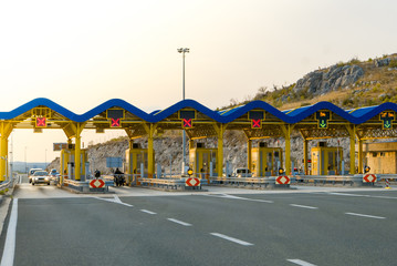 Cars passing through the toll gate on the motorway