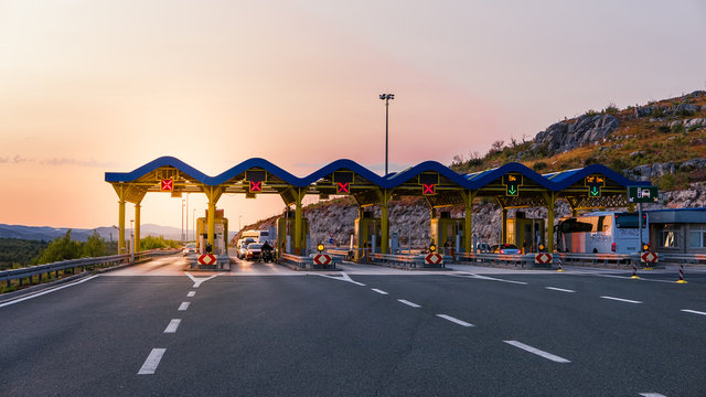 Cars passing through the toll gate on the motorway, vivid trabel