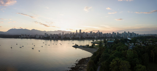 Downtown Vancouver Panorama from an aerial perspective during a vibrant summer sunrise. Taken from Kits Beach, British Columbia, Canada.