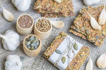 Healthy snack: cereal crunchy multigrain cereal flax seed pumpkin, coriander, sunflower seeds protein bread bar. Protein albumen source. Salted diet crispy crackers. Wholemeal.