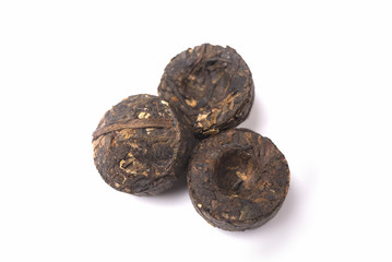 Pressed Puer tea isolated on white background closeup