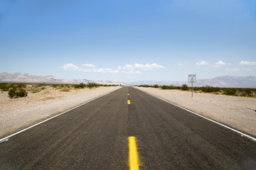 The never ending highway running through the California desert 