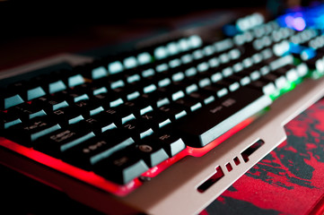 Led colored keyboard close up shot.