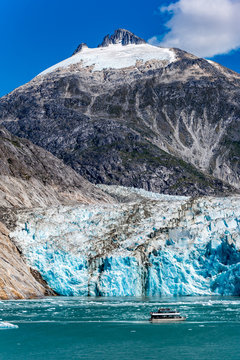 Wide angle view of Dawes Glacier with tourist boat