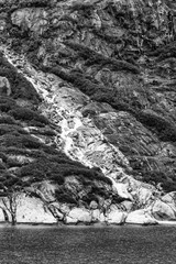 Monochrome view of alaskan hillside with waterfall