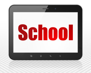 Studying concept: Tablet Pc Computer with School on display