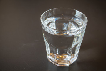 Glass of water on a wooden table