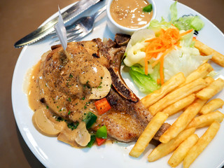 Kurobuta pork chop with black pepper sauce easy. Top view close up