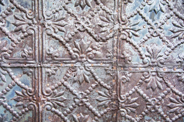 An unusual metal texture on the side of an abandoned building 