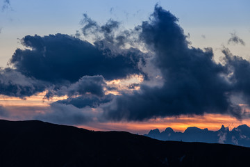 Sunset dolomites skyline and cloudy sky, Veneto, Italy