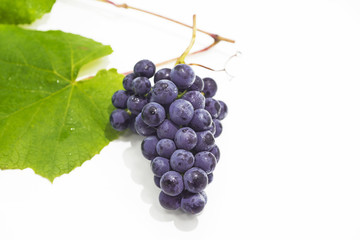 Raw dark grapes isolated on white background.