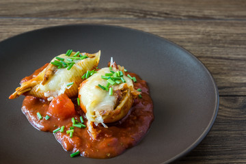 Conchiglioni with meat and cheese in tomato sauce