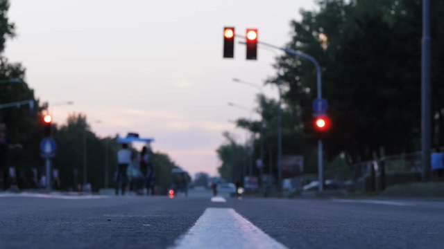 Empty street with no cars just pedestrians and bicycles in dusk