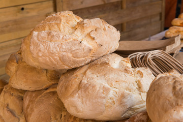 Rustic bread loaves on a market stall, Badajoz © Analisisgadgets