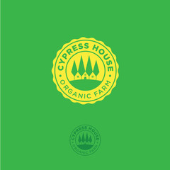 Organic farm emblem. Cypress house logo. Cypress trees and a farm in a yellow badge