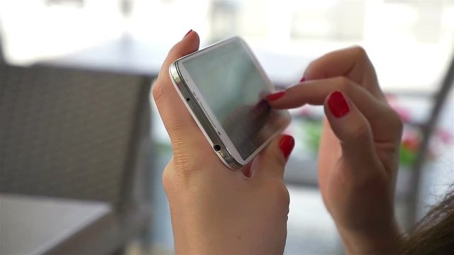 Video of woman using mobile phone