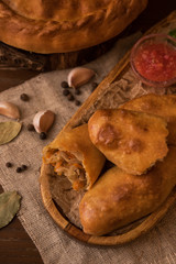 Fototapeta premium Different pies from meat and vegetables. Freshly baked cakes on a table