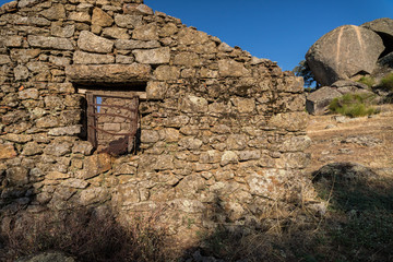 Landscape with window of house in ruins. Near Plasencia. Spain.