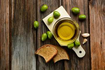 bread and olive oil on wooden table