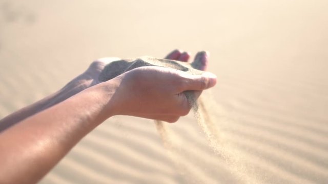 Young woman falling beach sand