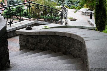 Photo of a staircase with turns leading to the city park