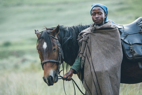 portrait of a Basotho herdsman with his horse
