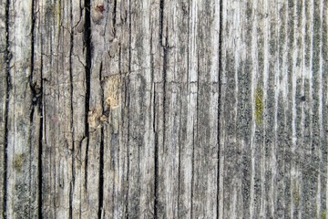 Wood texture - dark destroyed fiber of old wooden buildings.
