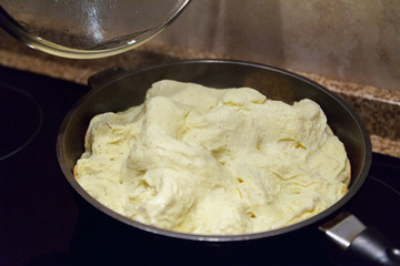Appetizing omelette in frying pan