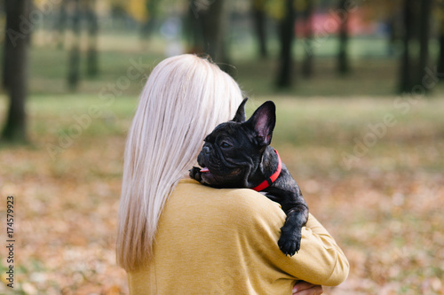 Beautiful And Happy Young Blond Woman Enjoying In Autumn Park With