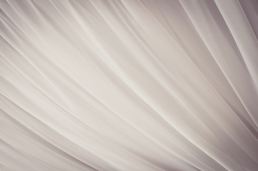 Soft tulle abstract fabric background. Toned image
