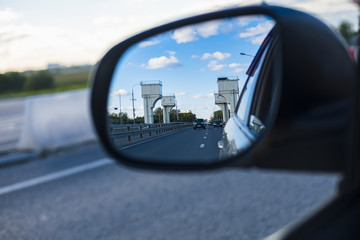 look in the rear view mirror of a car