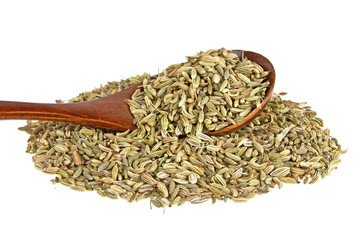 Fennel seeds in wooden spoon over white background