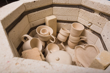 pottery, workshop, ceramics art concept - top view of electric oven for further roasting of...