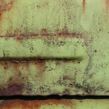 Peinture verte sur plaque m&eacute;tallique rouill&eacute;e
