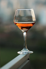 Glass of wine on top of the computer
