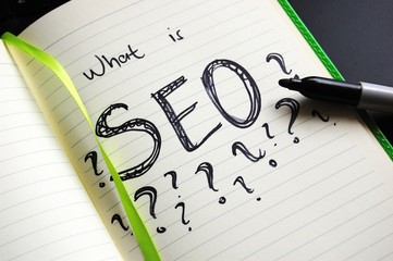 page in the notebook with SEO abbreviation and question marks 