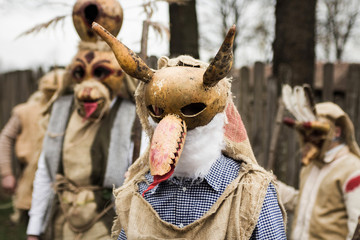 Young peolpe during old slavic festival dressed like forest spirits  