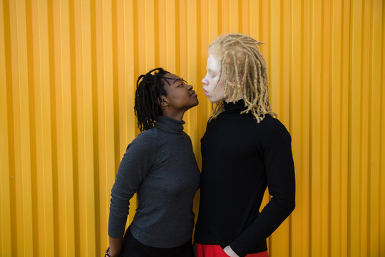 Flirting couple with dreadlocks on a first date