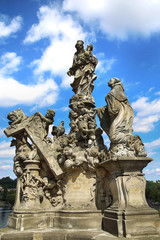 Fototapeta na wymiar Statuary of the Madonna and St. Bernard on the Charles Bridge (Karluv Most) in Prague, Czech Republic